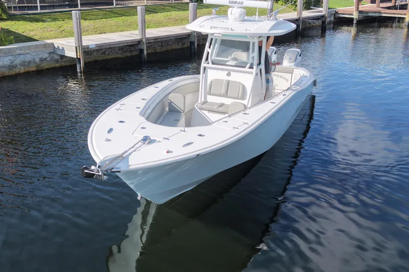 Slide: The Image of 2023 Cape Horn 32 XS boat docked in calm waters, showcasing sleek design. - 3