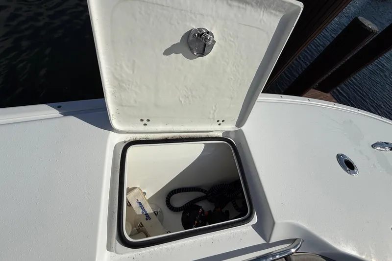 Slide: The Image of 2023 Cape Horn 32 XS boat compartment with open hatch, showing interior details. - 30