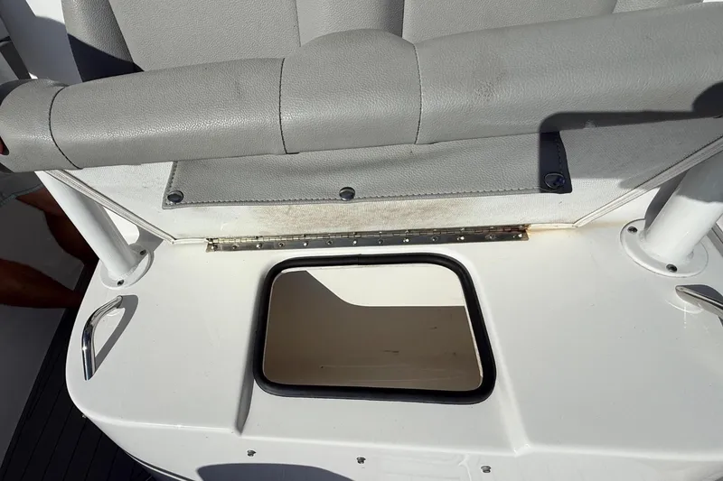 Slide: The Image of 2023 Cape Horn 32 XS boat interior with seating and storage compartment. - 41