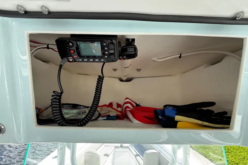 Slide: The Image of Storage compartment in 2023 Cape Horn 32 XS boat with radio and gear. - 46