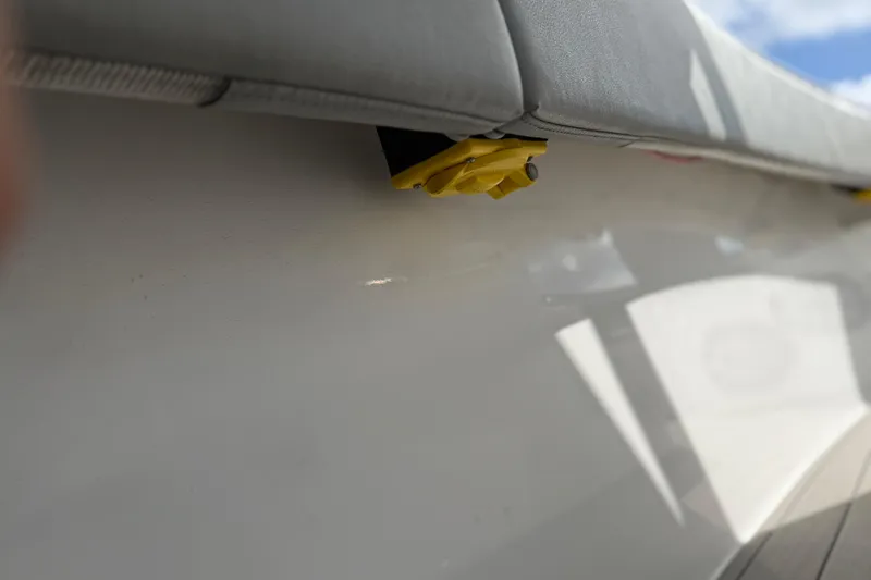 Slide: The Image of 2023 Cape Horn 32 XS boat detail with yellow fitting and cushioned seating. - 47