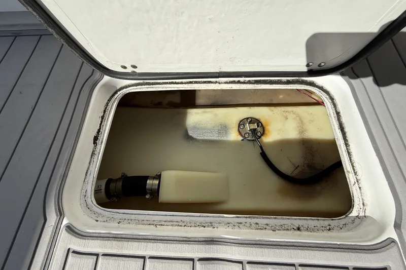 Slide: The Image of Open hatch of 2023 Cape Horn 32 XS boat showing internal compartment and components. - 53