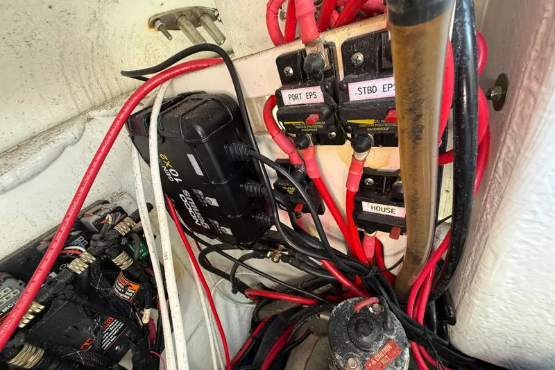 Slide: The Image of Electrical wiring and components inside a 2023 Cape Horn 32 XS boat. - 56