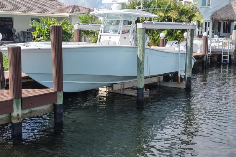 Slide: The Image of 2023 Cape Horn 32 XS boat docked at a waterfront property. - 7