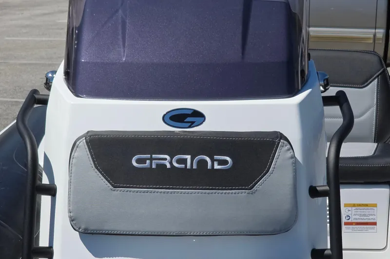 Slide: The Image of 2026 Grand Inflatables G420 boat console with logo and seating detail. - 10