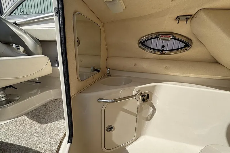 Slide: The Image of Interior of 2005 Sea Ray 240 Sundeck boat with sink and storage. - 15