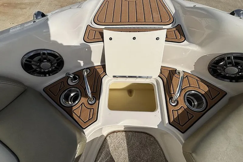 Slide: The Image of Interior view of a 2005 Sea Ray 240 Sundeck boat with cup holders and speakers. - 25