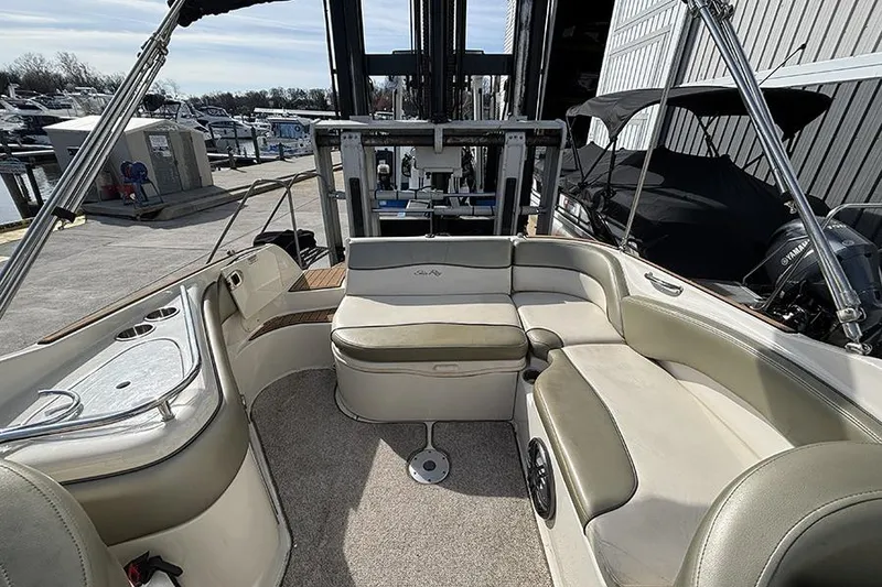 Slide: The Image of 2005 Sea Ray 240 Sundeck interior with spacious seating and modern amenities. - 6