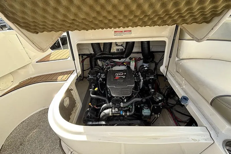 Slide: The Image of Engine compartment of a 2005 Sea Ray 240 Sundeck boat, showcasing the engine details. - 9