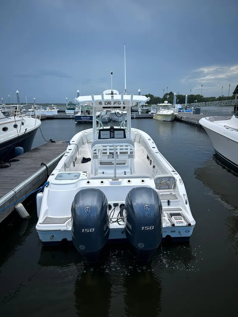 Slide: The Image of 2022 Sea Fox 268 Commander boat docked with dual 150 engines. - 13