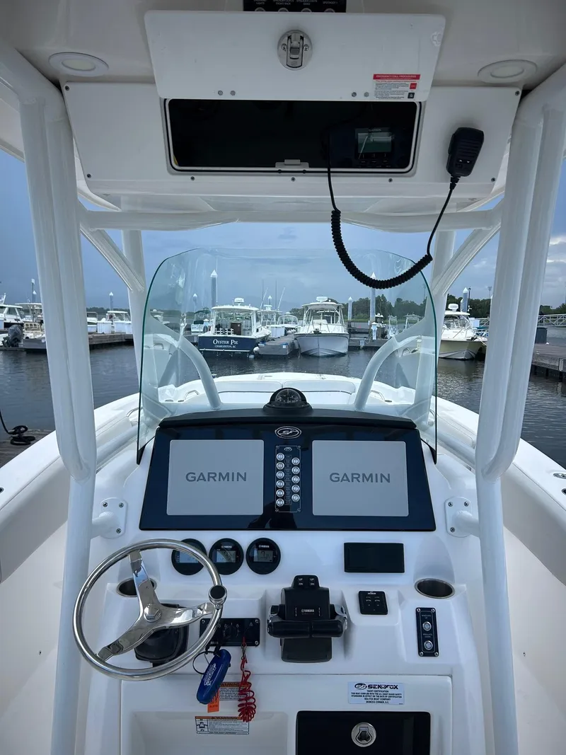 Slide: The Image of 2022 Sea Fox 268 Commander boat dashboard with Garmin navigation system at marina. - 5