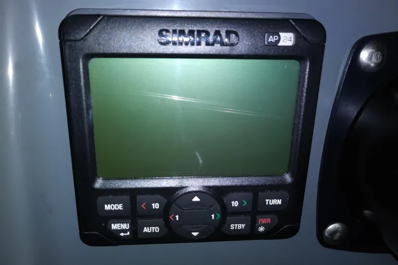 Slide: The Image of Simrad AP24 autopilot display on 1993 Tiara 3100 Open boat dashboard. - 11