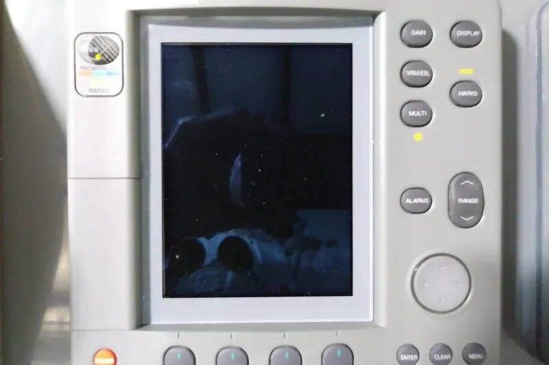 Slide: The Image of Close-up of a marine navigation system on a 1993 Tiara 3100 Open boat. - 12