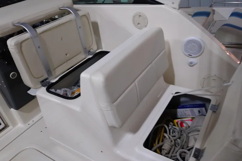 Slide: The Image of 1993 Tiara 3100 Open boat interior with storage compartments and seating. - 14