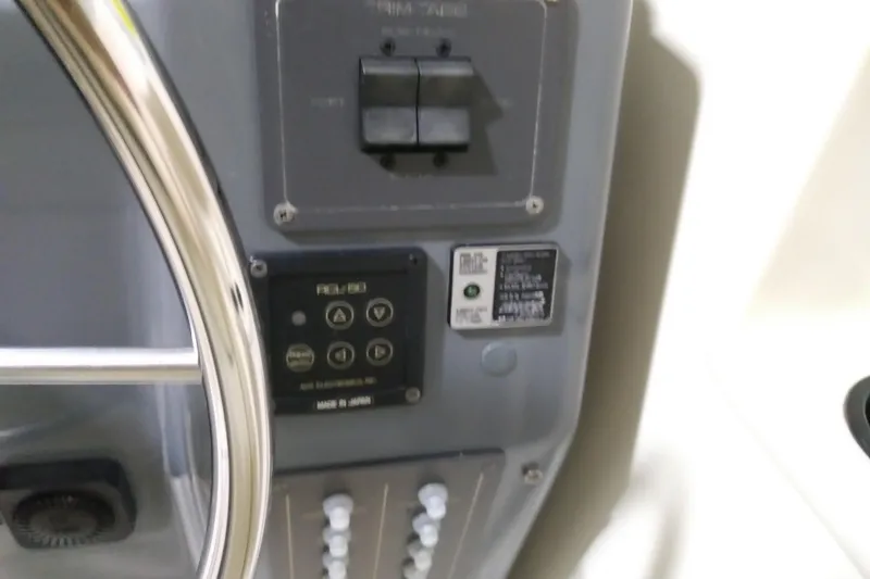 Slide: The Image of Control panel of a 1993 Tiara 3100 Open boat with steering wheel. - 17