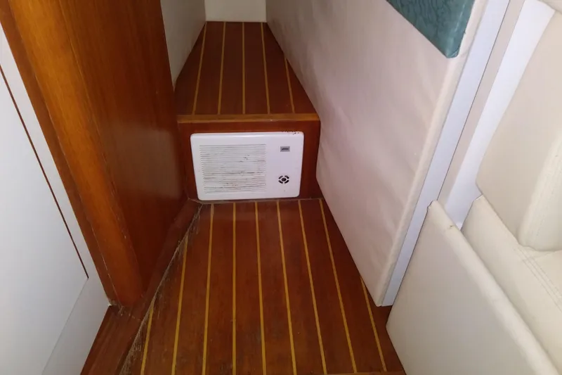 Slide: The Image of Interior of 1993 Tiara 3100 Open boat with wooden flooring and wall vent. - 27
