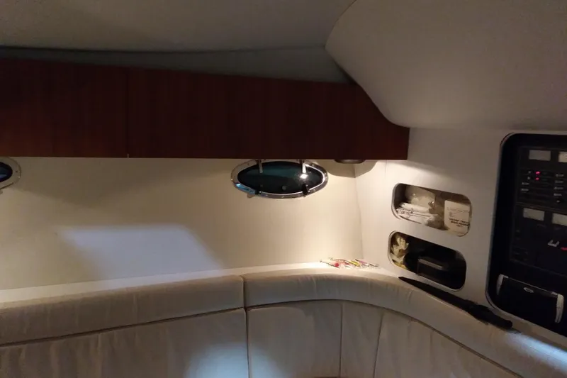 Slide: The Image of Interior of a 1993 Tiara 3100 Open yacht with cozy seating and storage compartments. - 29