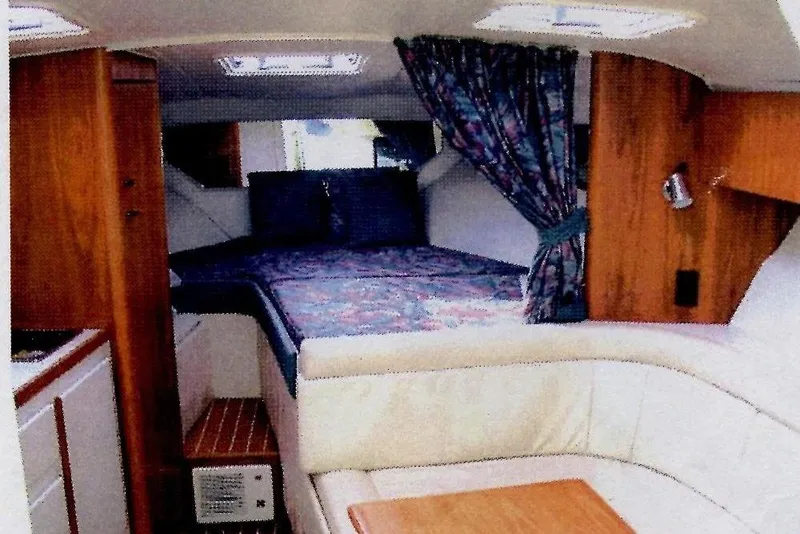 Slide: The Image of Interior of 1993 Tiara 3100 Open yacht with cozy seating and bed area. - 4