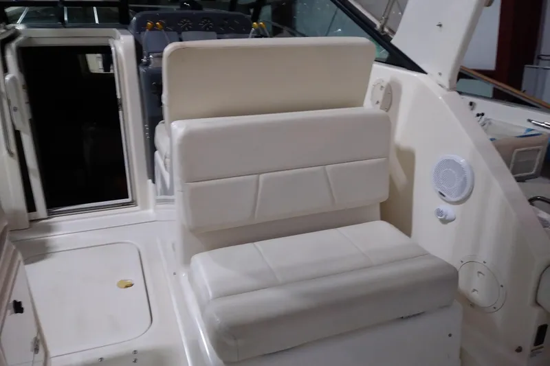 Slide: The Image of 1993 Tiara 3100 Open boat interior with white seating and control panel. - 7