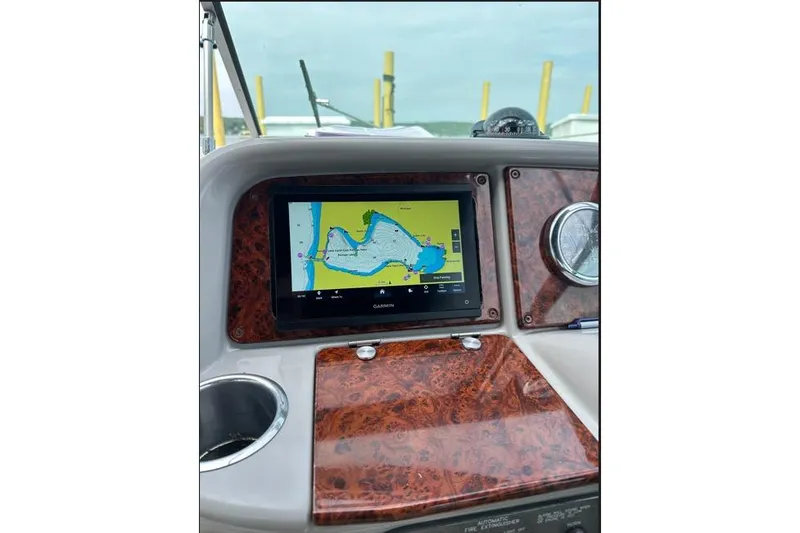 Slide: The Image of Dashboard of 2002 Formula 330 Sun Sport with Garmin navigation display. - 13