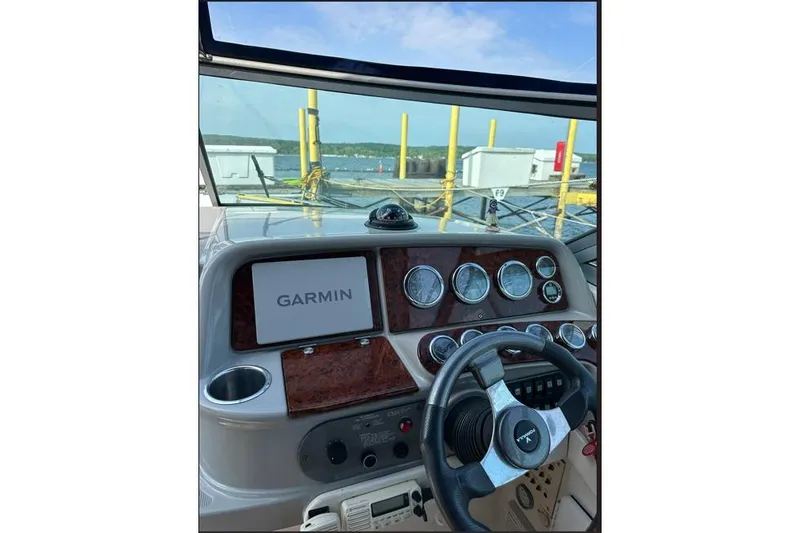 Slide: The Image of 2002 Formula 330 Sun Sport dashboard with Garmin navigation system and steering wheel. - 14