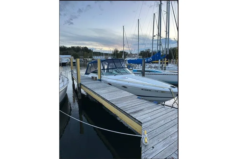 Slide: The Image of 2002 Formula 330 Sun Sport docked at marina during sunset. - 6