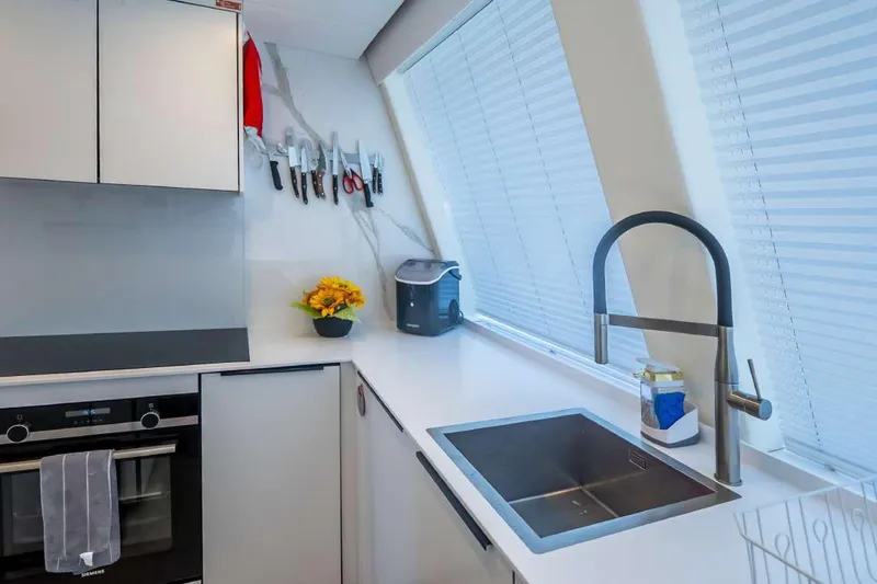 Slide: The Image of Modern kitchen interior on 2021 Sunreef Supreme 68 Power yacht, featuring sleek design and appliances. - 11