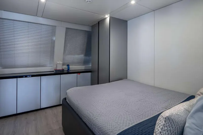 Slide: The Image of Modern bedroom interior on 2021 Sunreef Supreme 68 Power yacht, featuring sleek design and cozy bedding. - 18