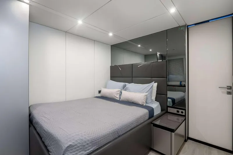 Slide: The Image of Luxurious bedroom interior on 2021 Sunreef Supreme 68 Power yacht, featuring modern design and cozy bedding. - 19