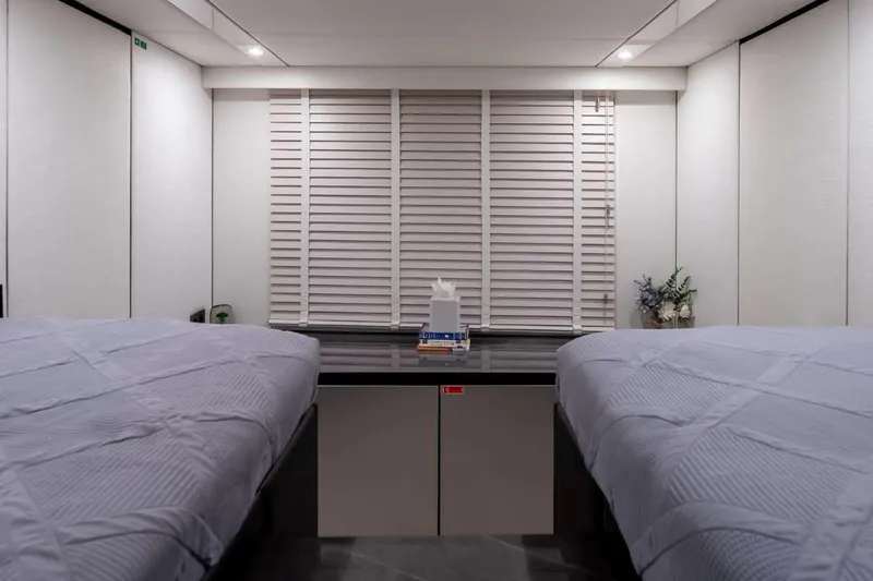 Slide: The Image of Interior cabin of 2021 Sunreef Supreme 68 Power yacht with twin beds and modern decor. - 21