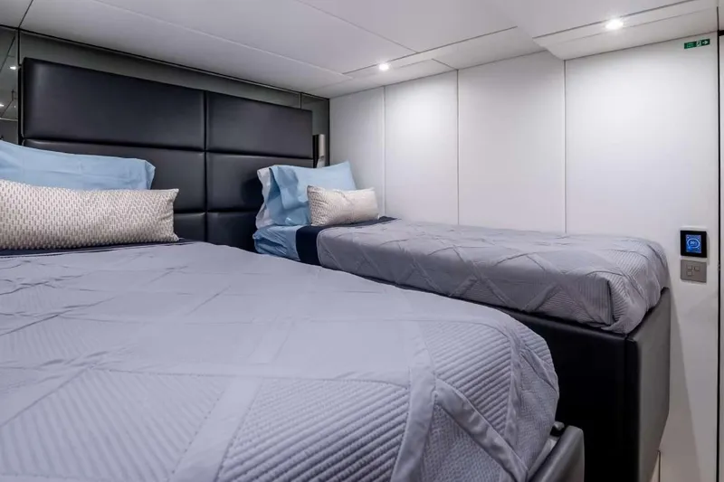 Slide: The Image of Luxurious twin bedroom in 2021 Sunreef Supreme 68 Power yacht, featuring modern design and plush bedding. - 22