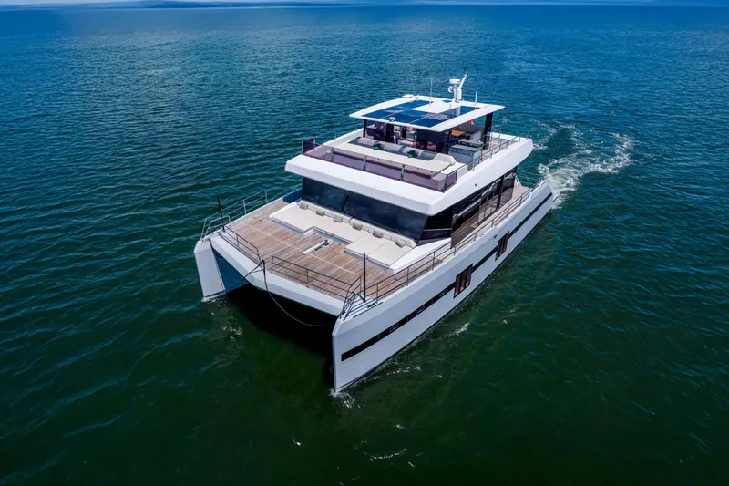 Slide: The Image of Luxurious 2021 Sunreef Supreme 68 Power yacht cruising on open water. - 3