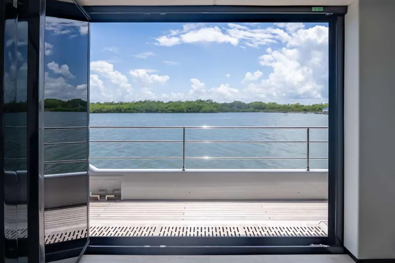 Slide: The Image of View from Sunreef Supreme 68 Power yacht, showcasing serene waters and lush greenery. - 30
