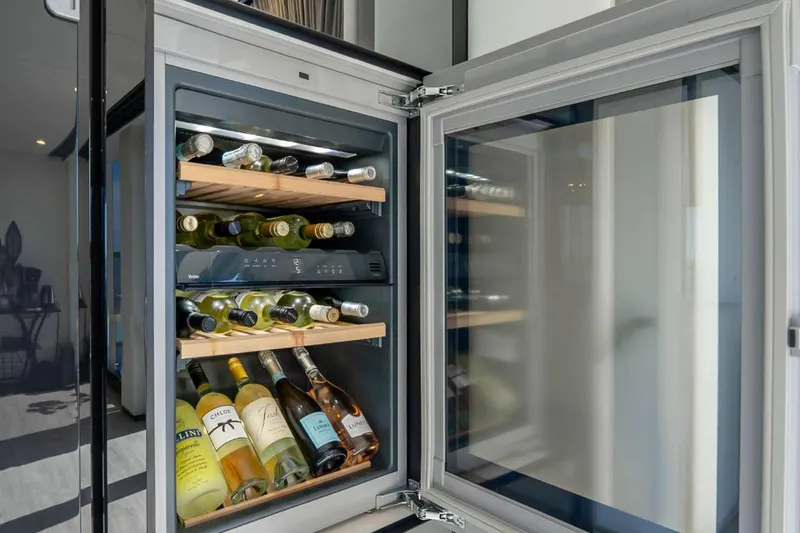 Slide: The Image of Wine cooler with assorted bottles inside Sunreef Supreme 68 Power yacht, 2021 model. - 35