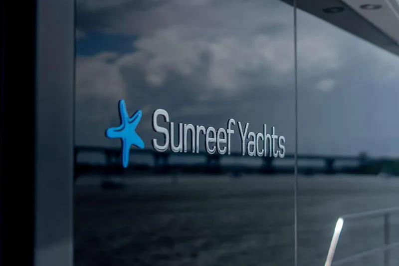 Slide: The Image of Sunreef Supreme 68 Power 2021 yacht with Sunreef Yachts logo on reflective surface. - 45