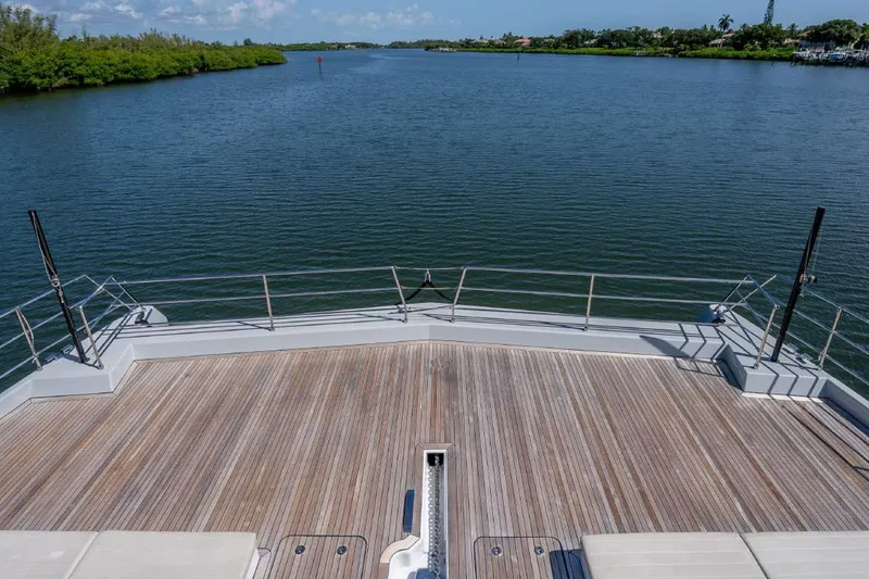 Slide: The Image of Sunreef Supreme 68 Power 2021 yacht deck overlooking serene waterway. - 49