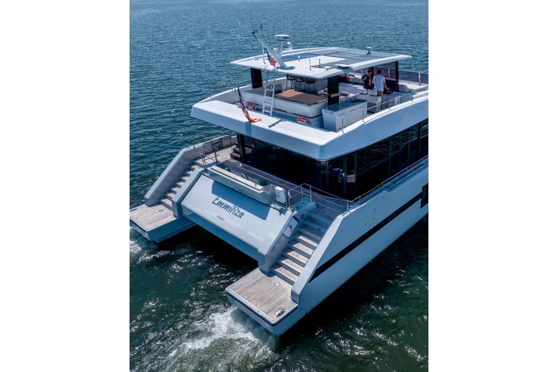Slide: The Image of 2021 Sunreef Supreme 68 Power yacht cruising on open water, rear view. - 5