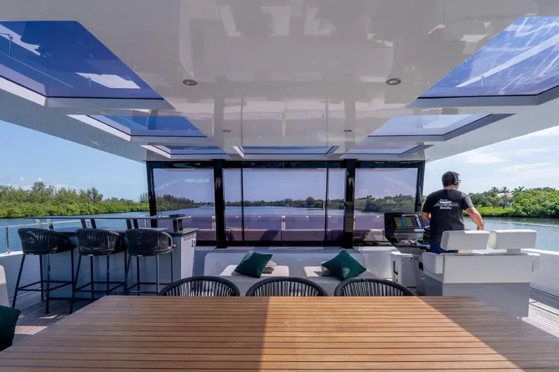 Slide: The Image of Luxurious Sunreef Supreme 68 Power yacht interior with modern seating and panoramic views, 2021 model. - 52