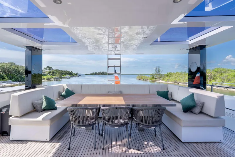 Slide: The Image of Luxurious Sunreef Supreme 68 Power yacht deck with elegant seating and scenic water view, 2021 model. - 53