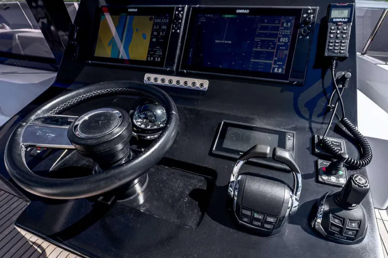 Slide: The Image of Cockpit of 2021 Sunreef Supreme 68 Power yacht with navigation controls and displays. - 56