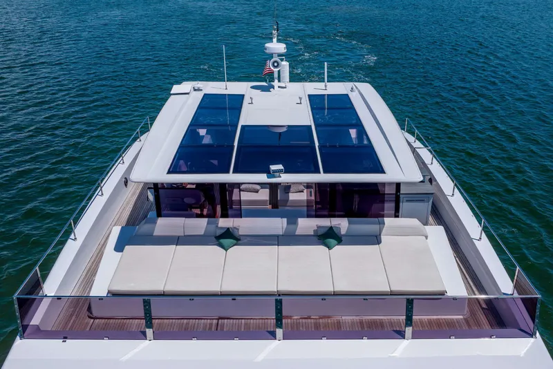 Slide: The Image of Luxurious 2021 Sunreef Supreme 68 Power yacht with spacious deck and sleek design on open water. - 58