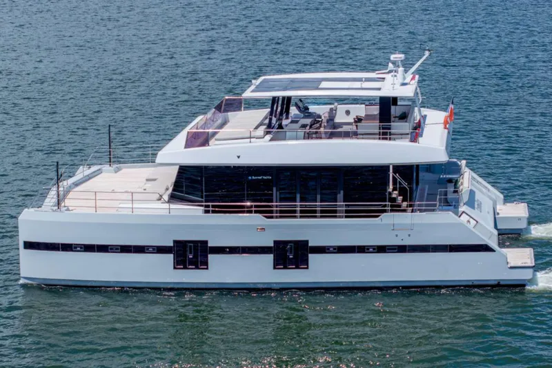 Slide: The Image of 2021 Sunreef Supreme 68 Power yacht cruising on open water. - 6