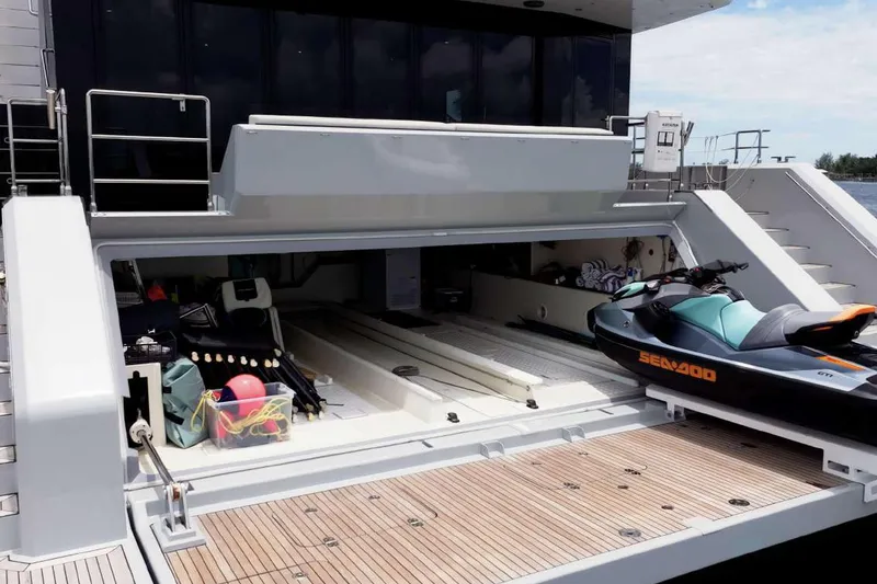 Slide: The Image of 2021 Sunreef Supreme 68 Power yacht with open garage, jet ski, and water sports equipment. - 60