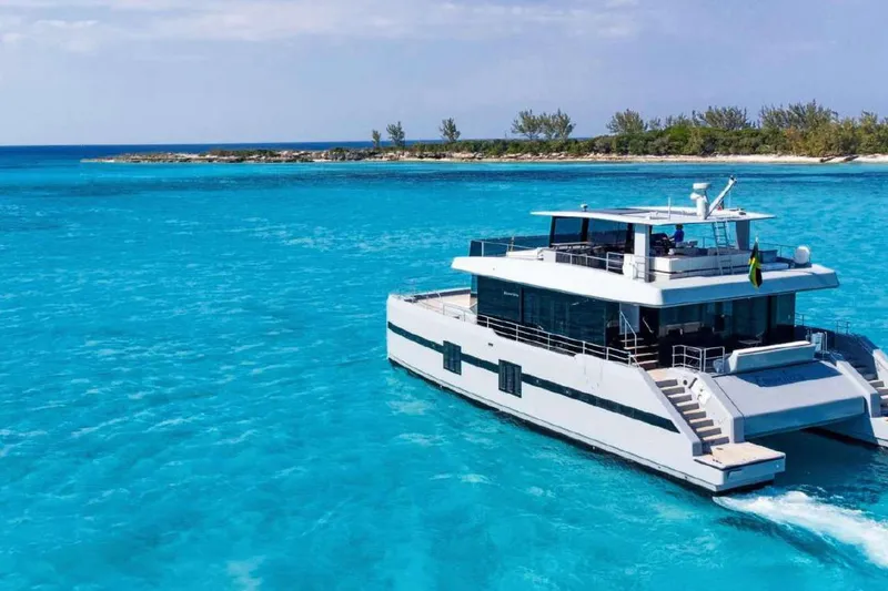 Slide: The Image of Luxury Sunreef Supreme 68 Power yacht cruising in turquoise waters, 2021 model. - 61