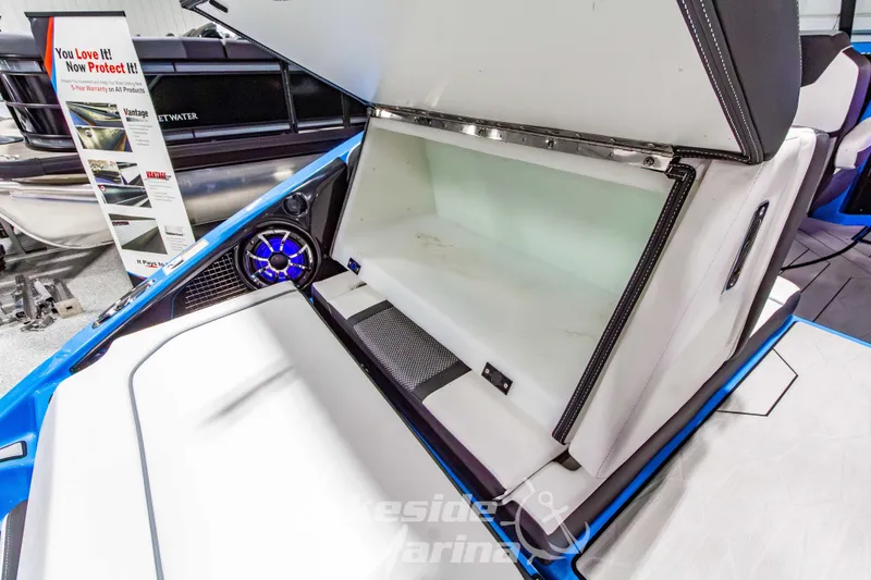 Slide: The Image of 2023 Yamaha Boats 255XE interior storage compartment with sleek design and modern features. - 13