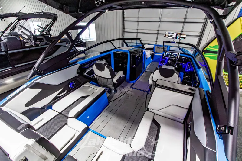 Slide: The Image of 2023 Yamaha Boats 255XE interior with modern seating and advanced dashboard features. - 18
