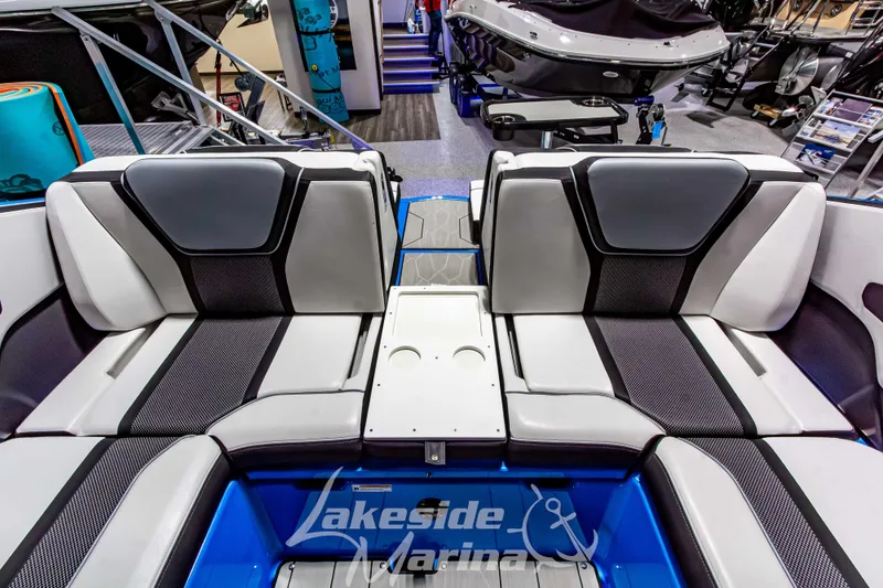 Slide: The Image of 2023 Yamaha Boats 255XE interior seating at Lakeside Marina showroom. - 27