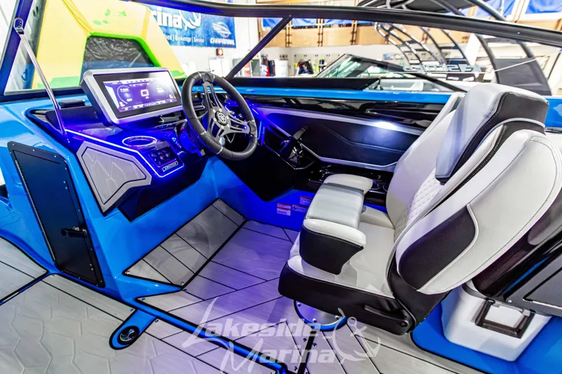 Slide: The Image of 2023 Yamaha Boats 255XE interior with modern dashboard and steering wheel. - 31