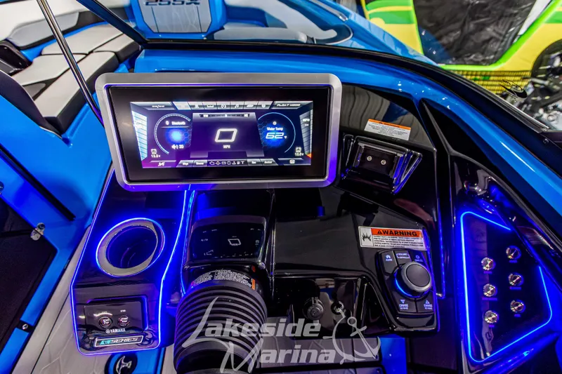 Slide: The Image of 2023 Yamaha Boats 255XE dashboard with touchscreen display and illuminated controls. - 33