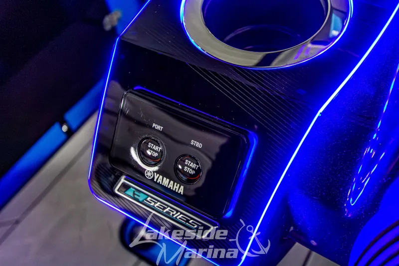 Slide: The Image of 2023 Yamaha Boats 255XE control panel with illuminated start-stop buttons. - 37